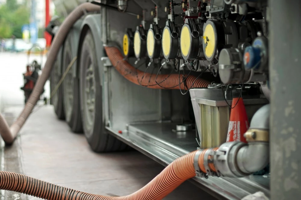  — © Fuel truck which refill. Hoses and pumps to load the truck